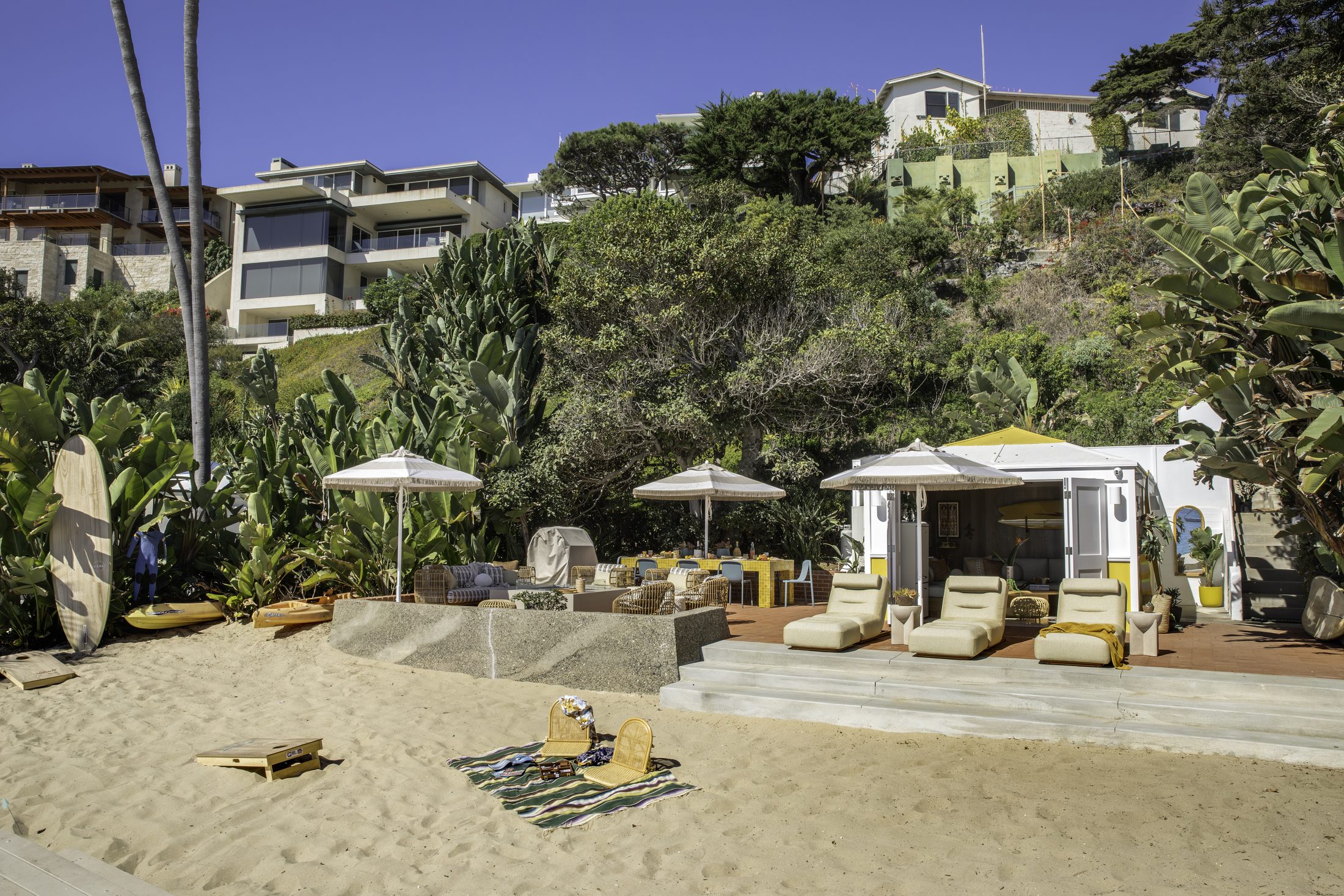 Private beach cabana set into the hillside above the sand