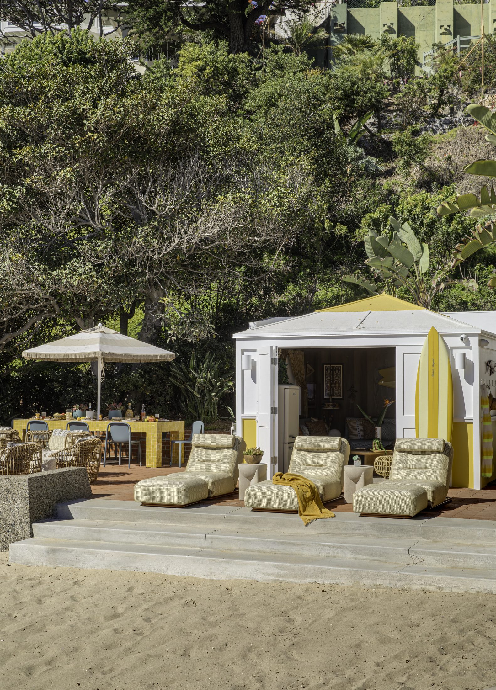 Cabana and umbrella seating looking back toward the beach