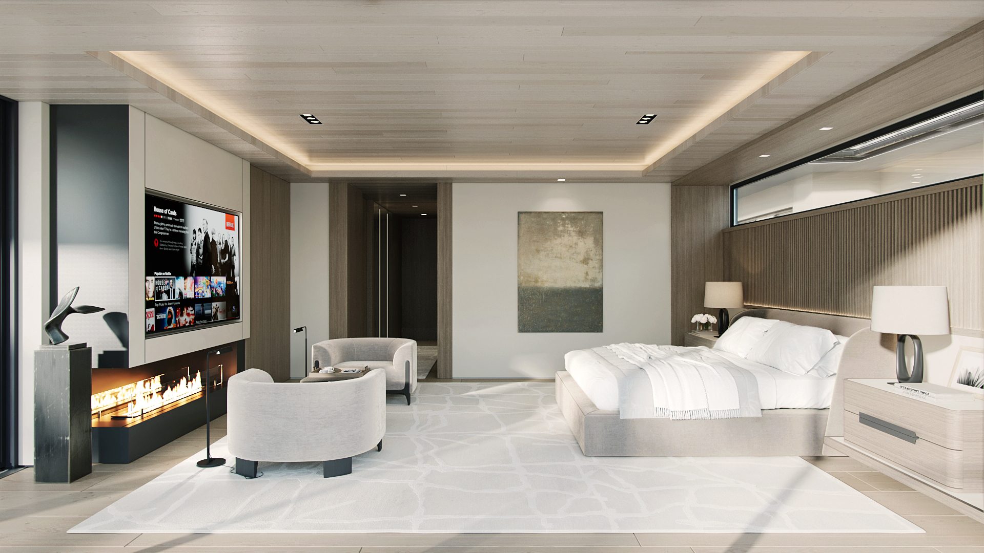 Primary suite with fireplace, lounge chairs, and floating millwork
