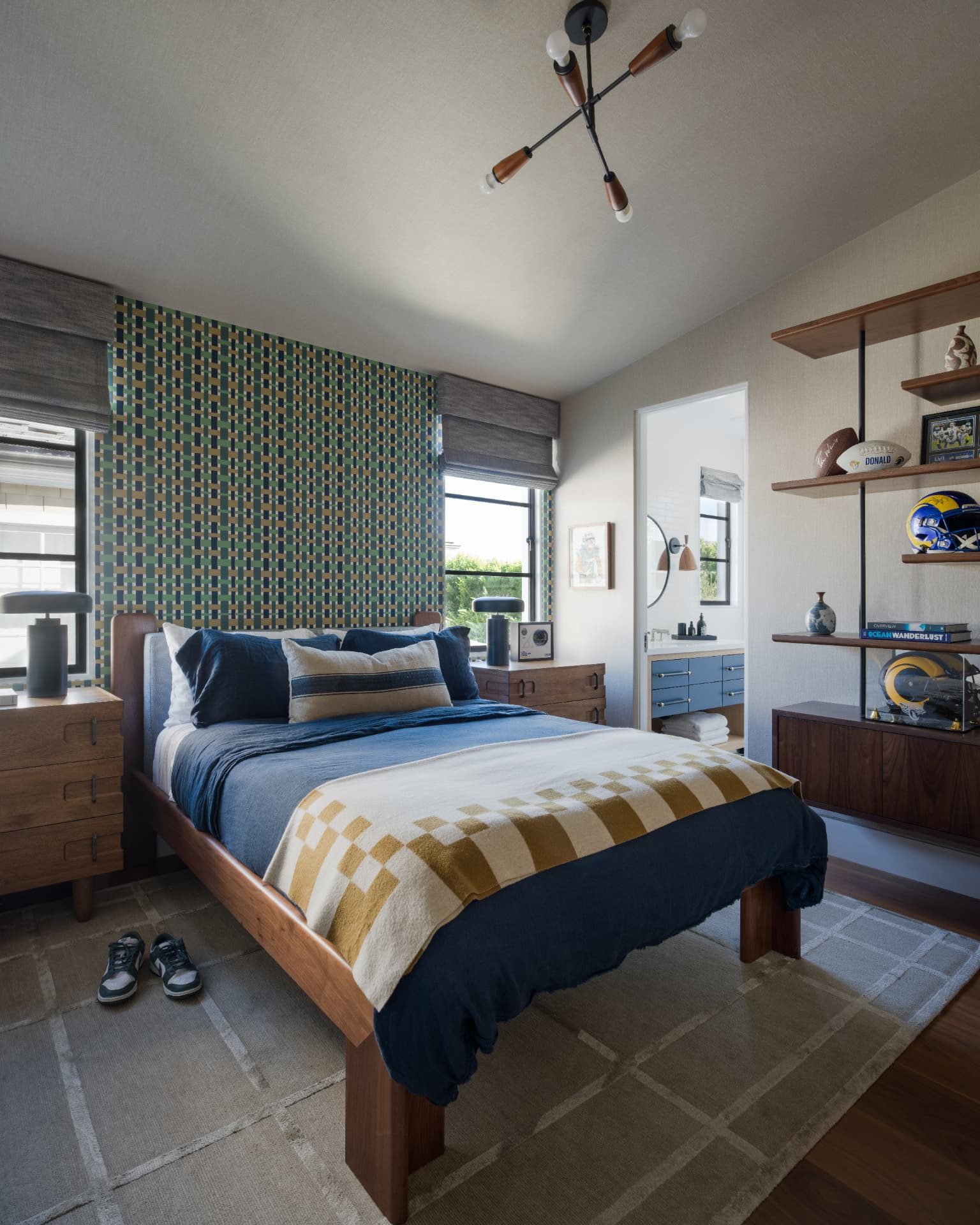 Boys' room with checkered wallpaper, walnut bed, and shelving