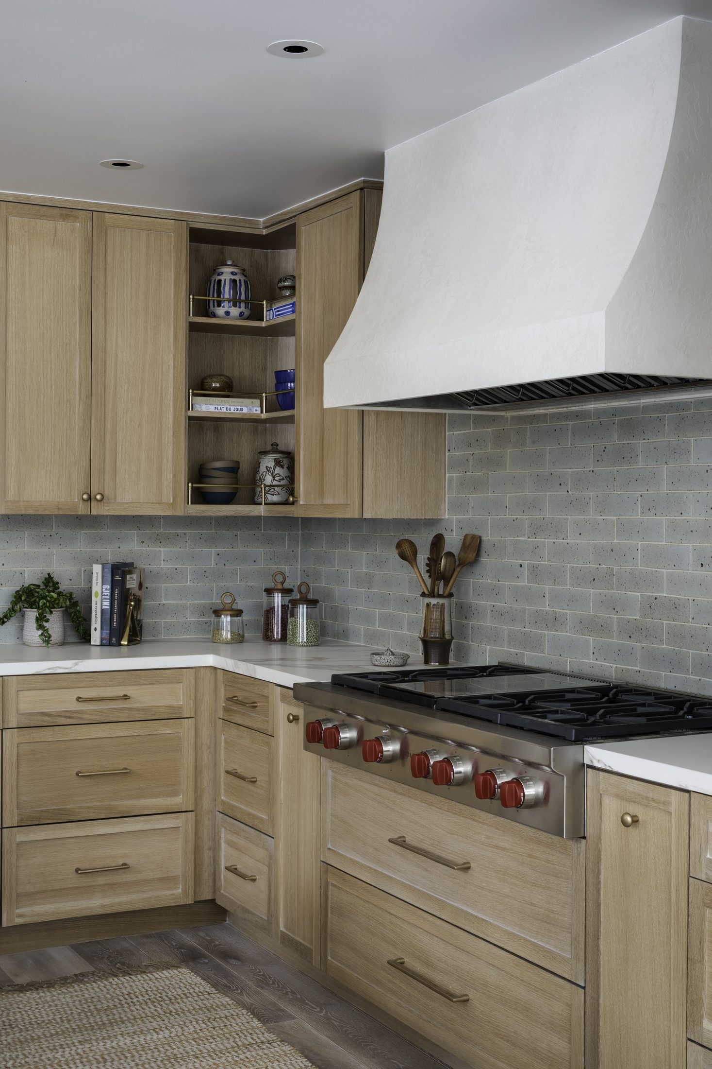 Range wall with plaster hood and open shelving