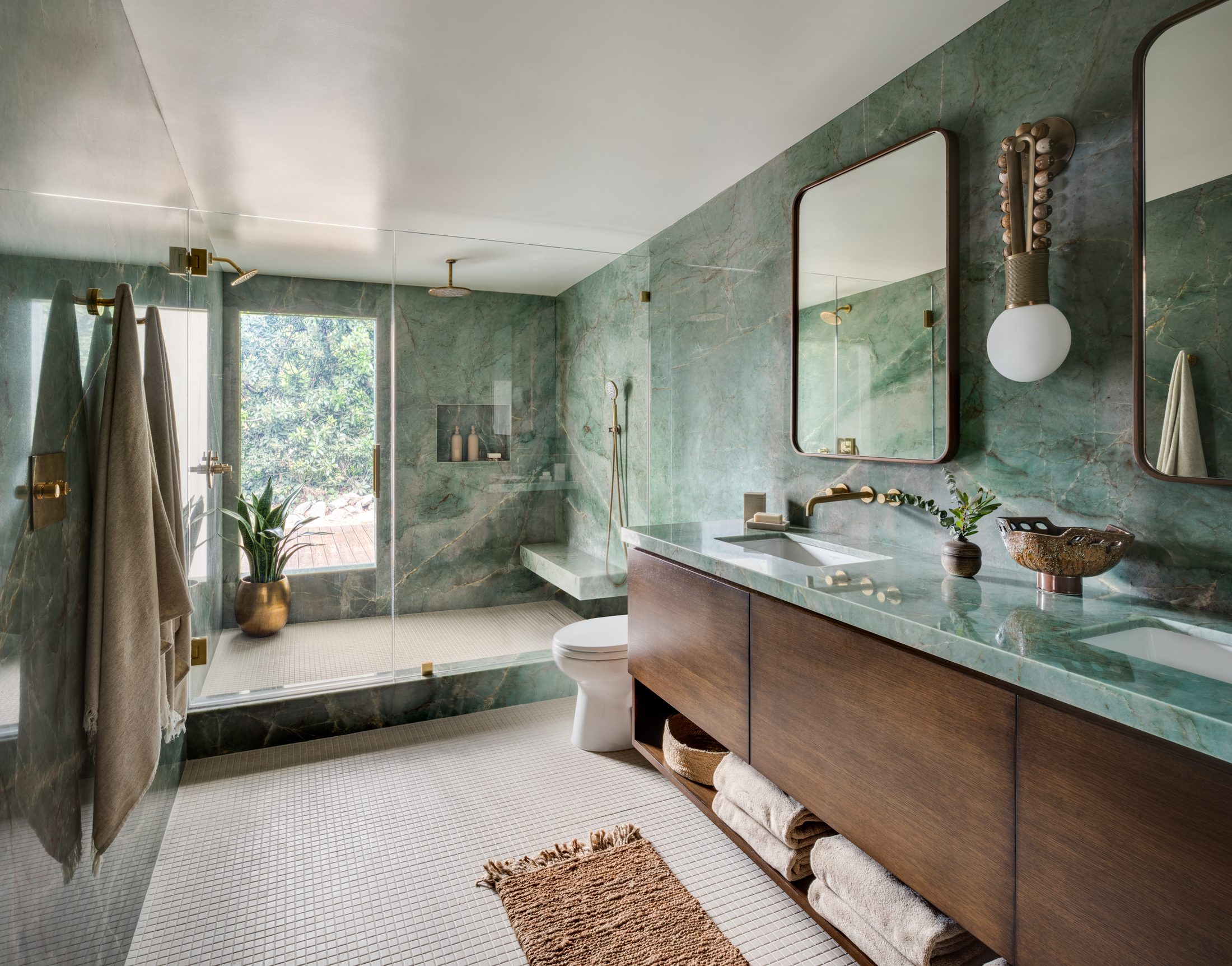 Wide view of the green marble bath with mosaic tile floor