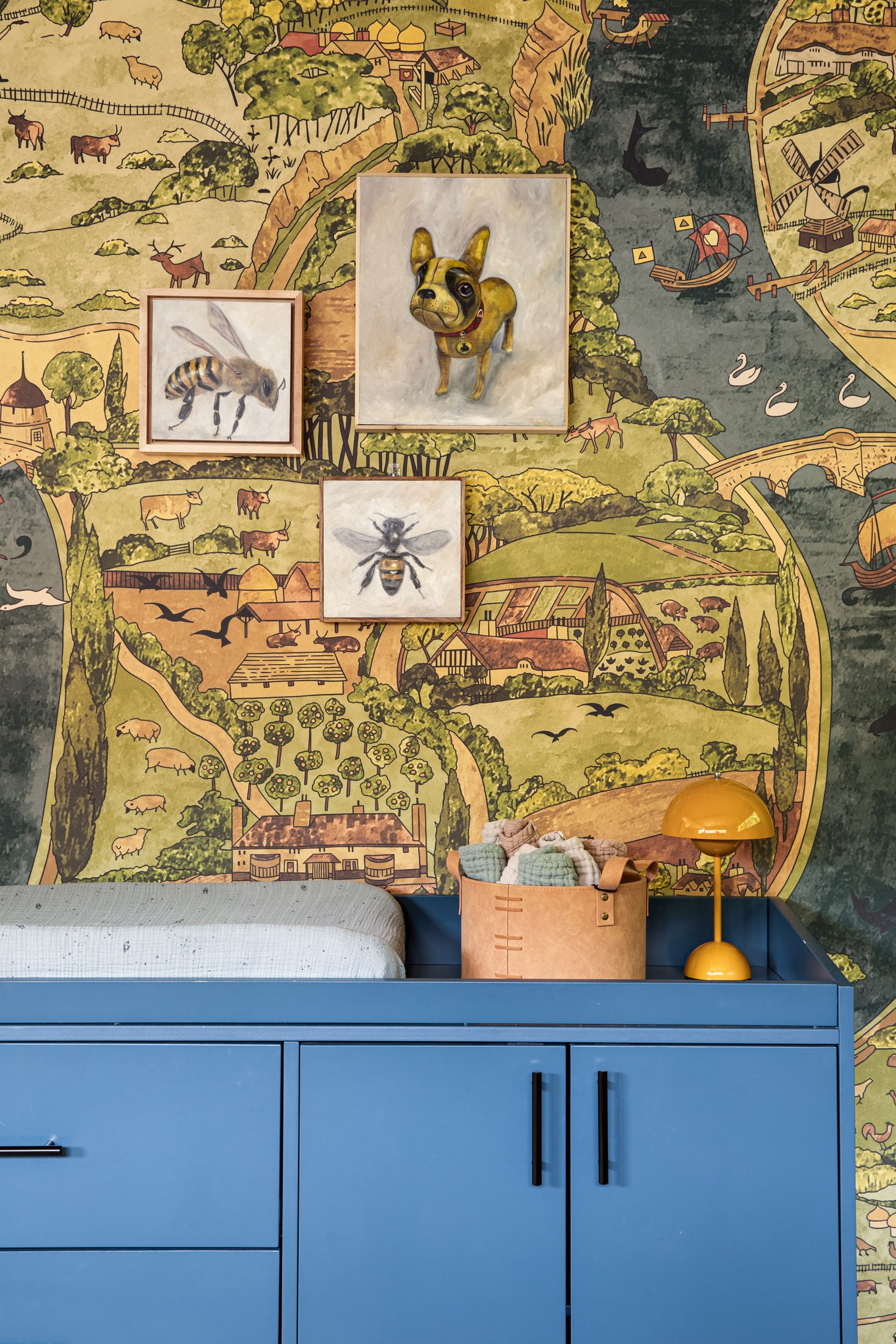 Changing station detail with framed insect studies on the mural