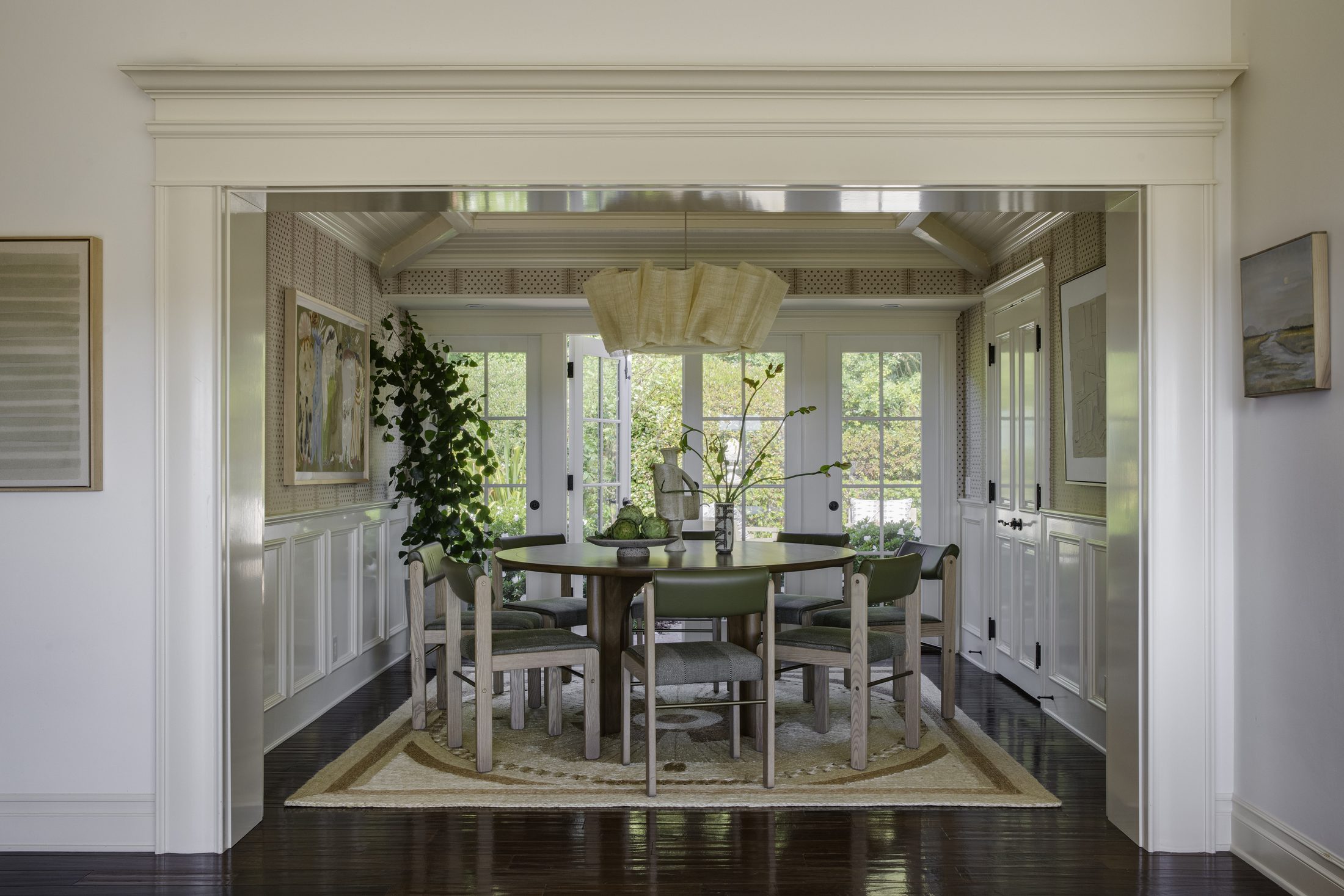 Enfilade view through paneled openings to the formal dining room